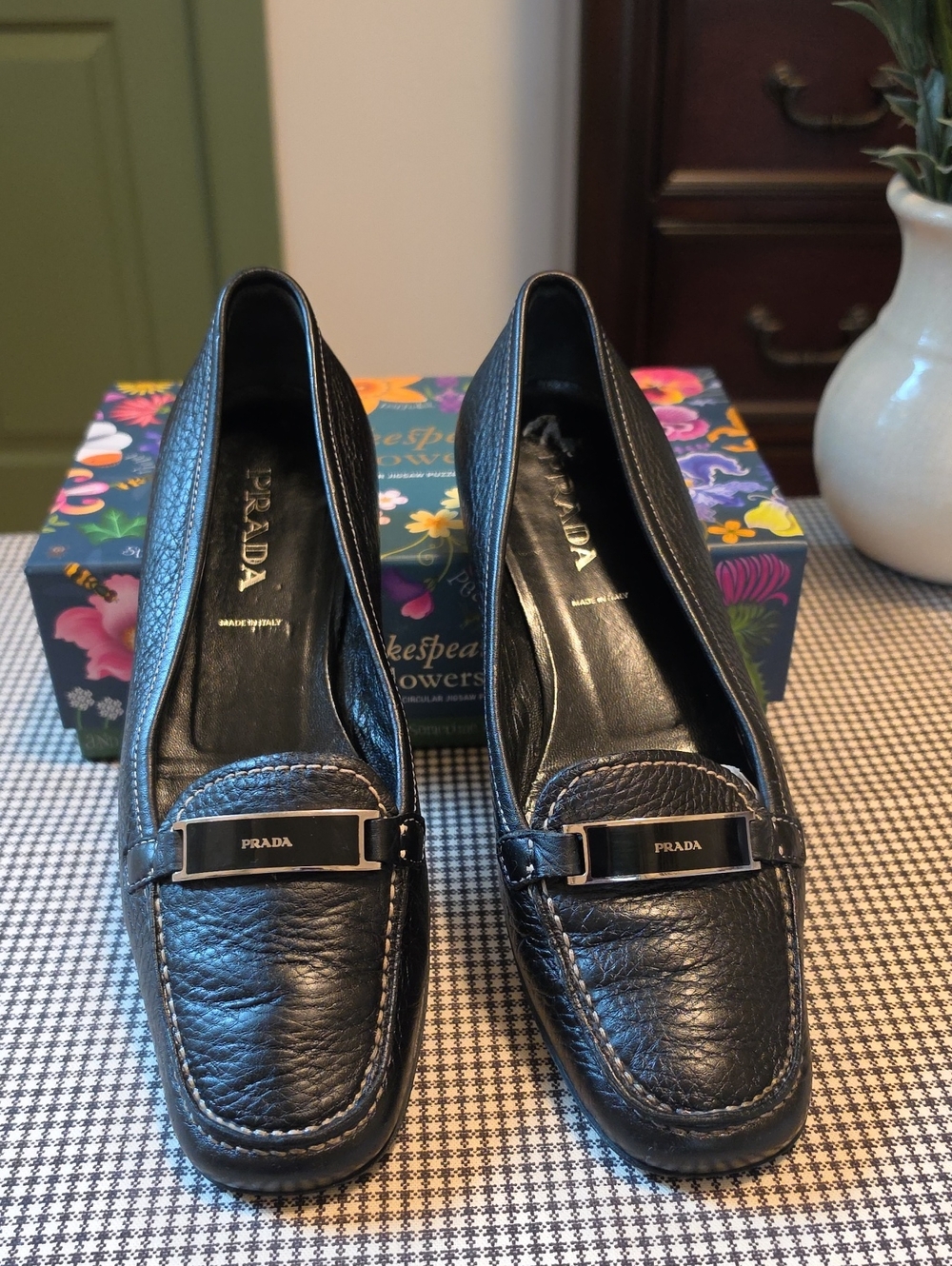 Prada Black Pebbled Leather Moc Toe Loafers Silver Logo Plaque